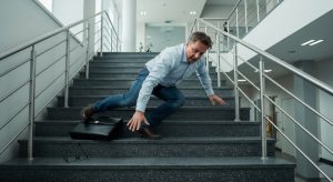 Man falls down the stairs becasue of faulty railing