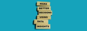 Make better decisions using data insights spelled out with wood blocks